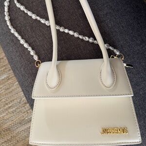 Elegant Cream Handbag with Pearl Strap